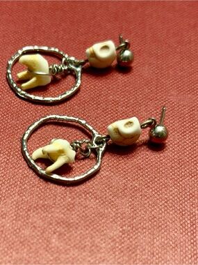 Raccoon teeth skelly earrings